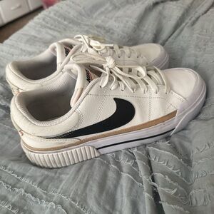 Nike White and Black Sneakers with Gold Accent